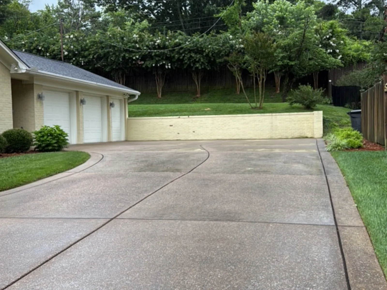 Aggregate driveway washed clean — before cleaning in Brentwood, TN