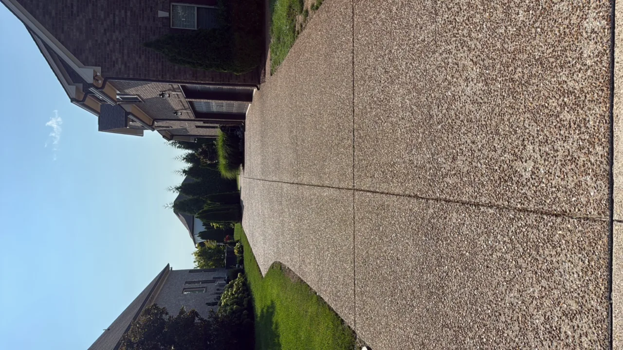 Exposed aggregate driveway cleaned and sealed — before cleaning in Franklin, TN
