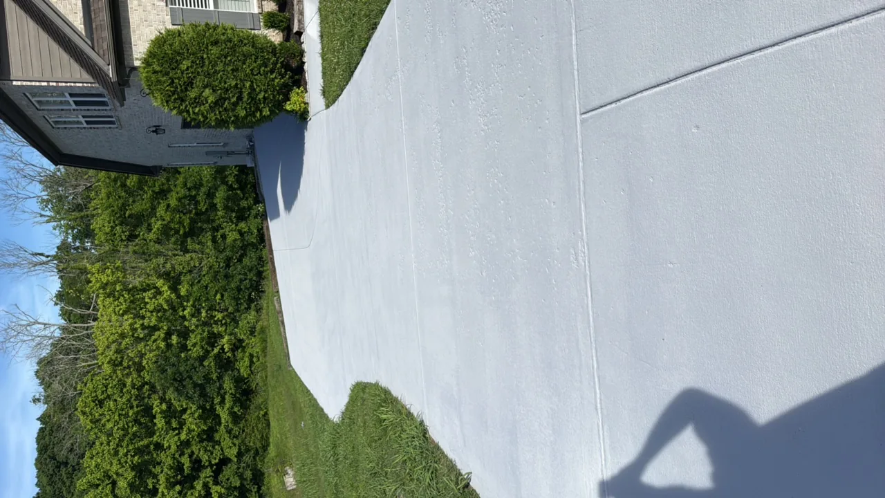 Concrete driveway cleaned and sealed — after professional cleaning in Franklin, TN