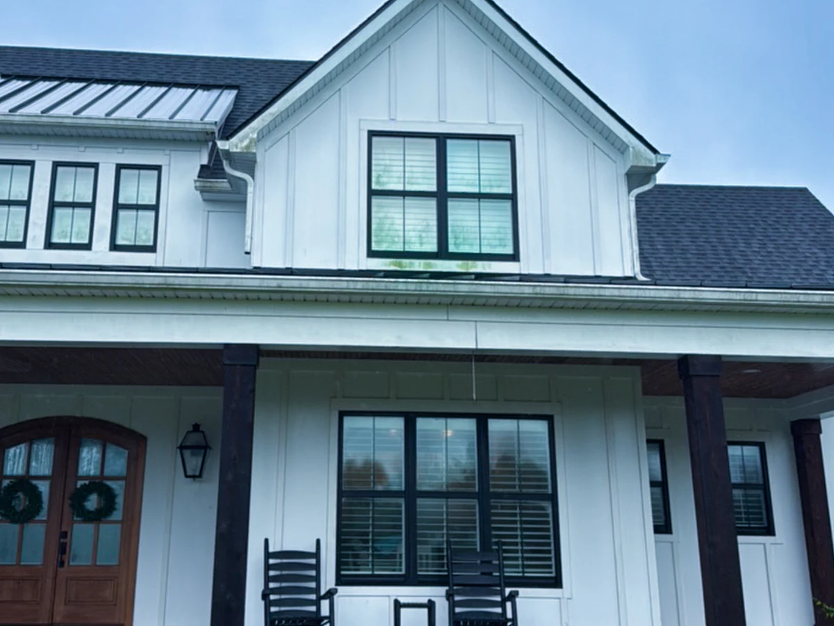 Dull siding and brick washed bright — before cleaning in Franklin, TN